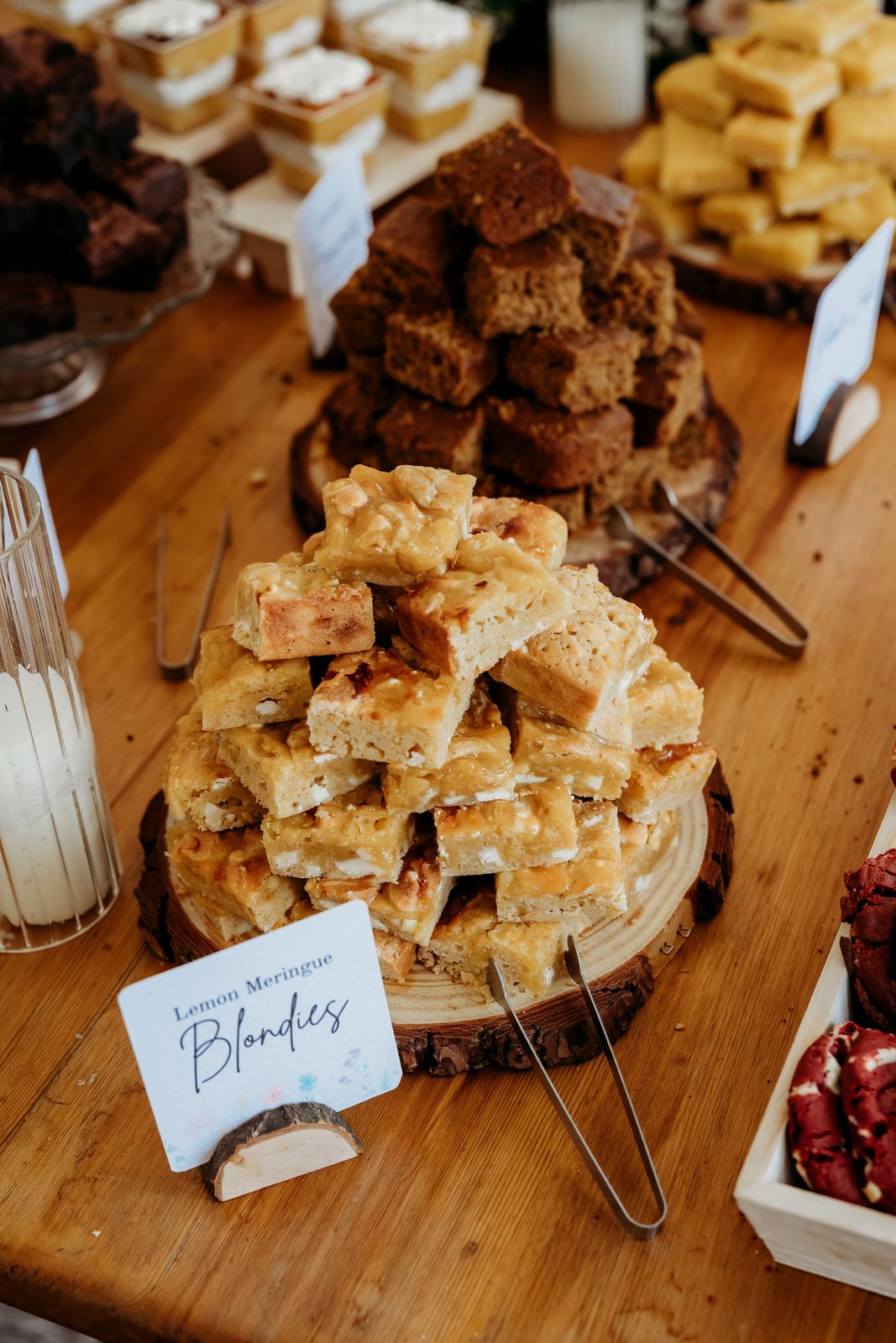 A pile of lemon meringue blondies with a handwritten label
